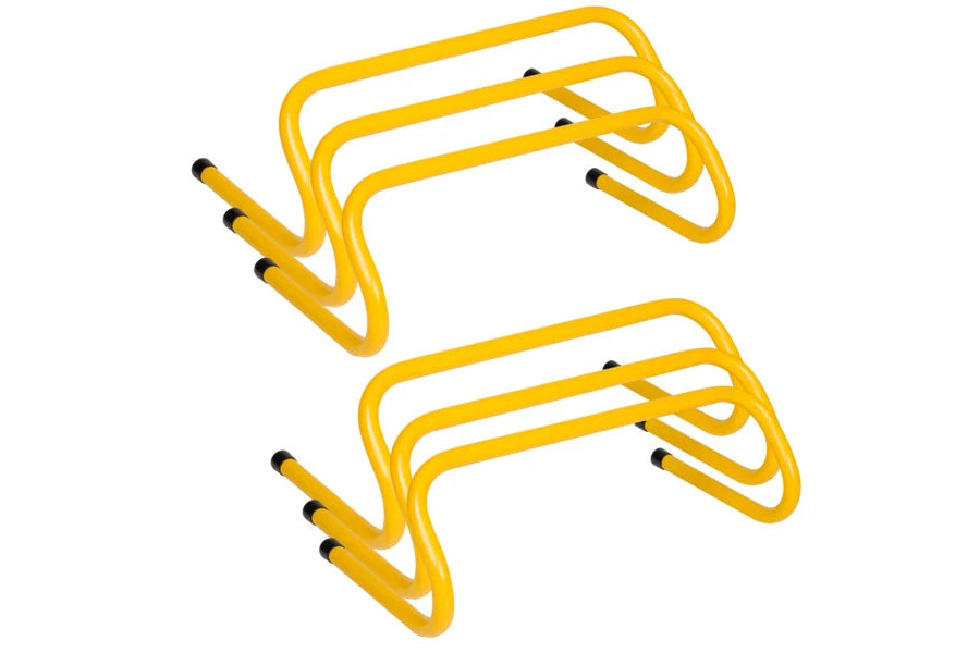 Set of two yellow plastic training hurdles with black rubber feet, flat lay on white background