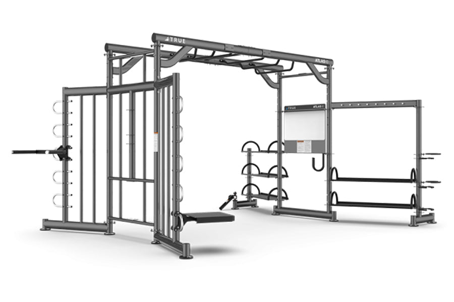 TRUE Atlas HD functional training system with cable crossover, weight storage, and barbell racks on white background