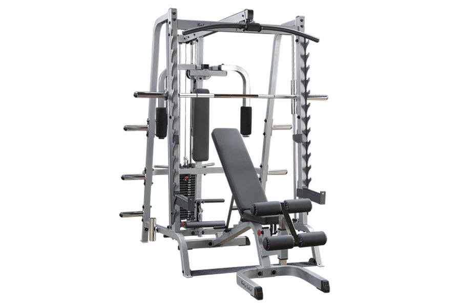 Smith machine with silver steel frame, black padded bench seat, and multiple barbell stations on white background