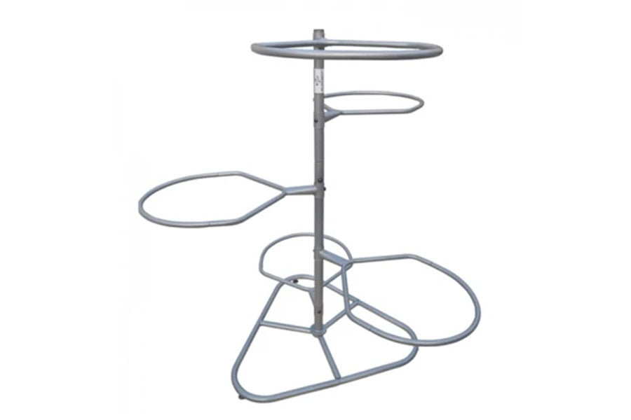 Gray metal multi-tier ball storage rack with four circular shelves on central pole, designed for organizing exercise and gym