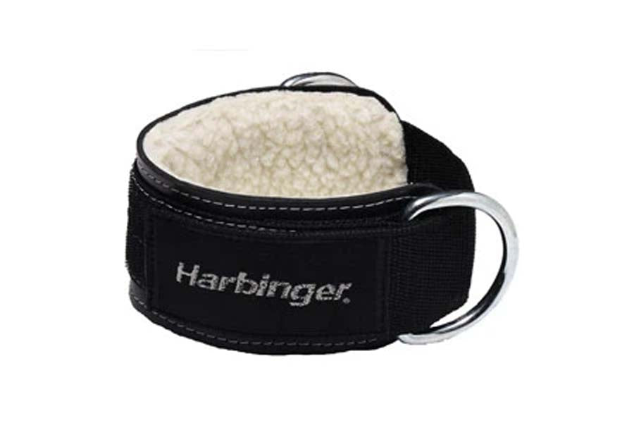 Black neoprene ankle cuff with cream sherpa lining and silver D-ring attachment, Harbinger branding on white background