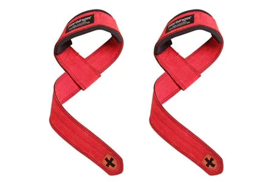Pair of red padded lifting straps with black labels and X logo on ends, flat lay on white background