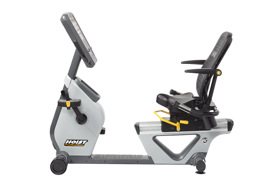 Hoist Lemond Series RC recumbent exercise bike in white and black with yellow accents, shown from the side on white backgroun