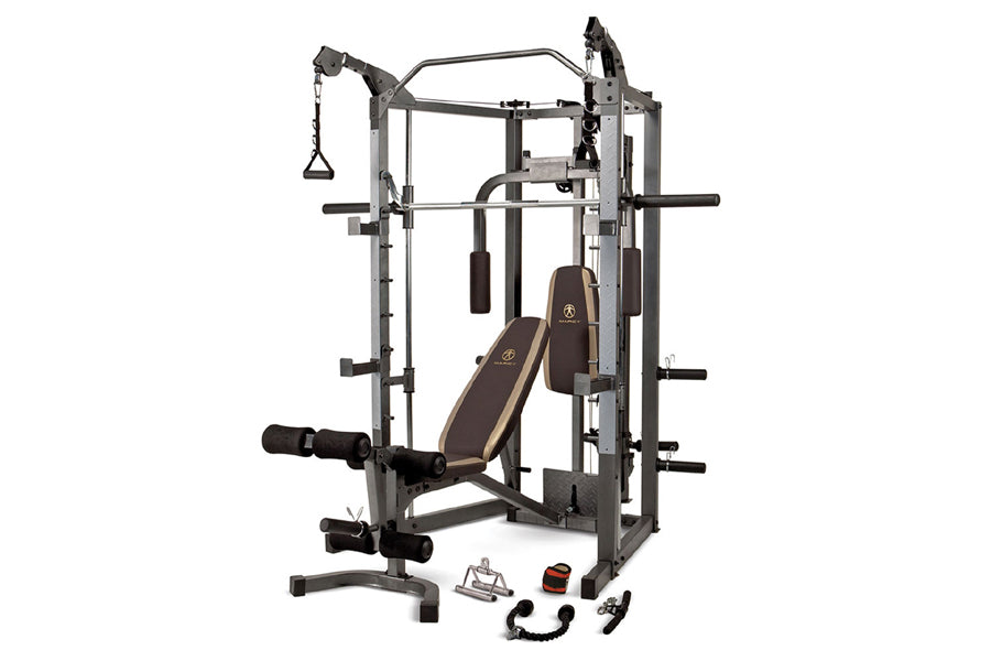 Marcy Smith Machine home gym with gray steel frame, brown padded seat and backrest, multiple cable attachments, and included