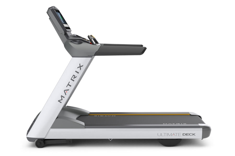 Matrix T130 treadmill with white frame, gray console, and black running deck on white background