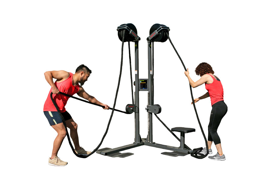 Two people using dual-station rope trainer with black handles and gray frame on white background