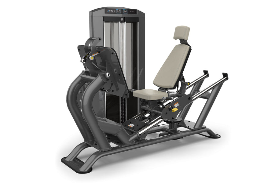 TRUE SPL-0300 seated leg press machine with black frame, gray upholstered seat with headrest, and adjustable footplate on whi