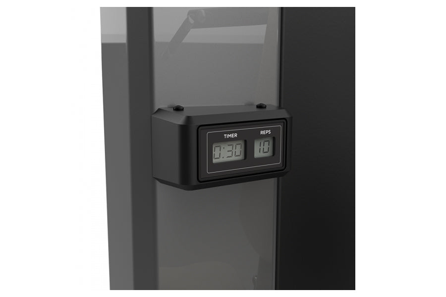 Black digital timer and rep counter display mounted on gray weight machine frame