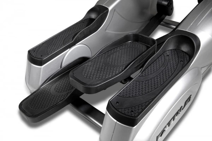 TRUE Performance 300 elliptical machine with silver frame, black textured foot pedals and handlebars on white background