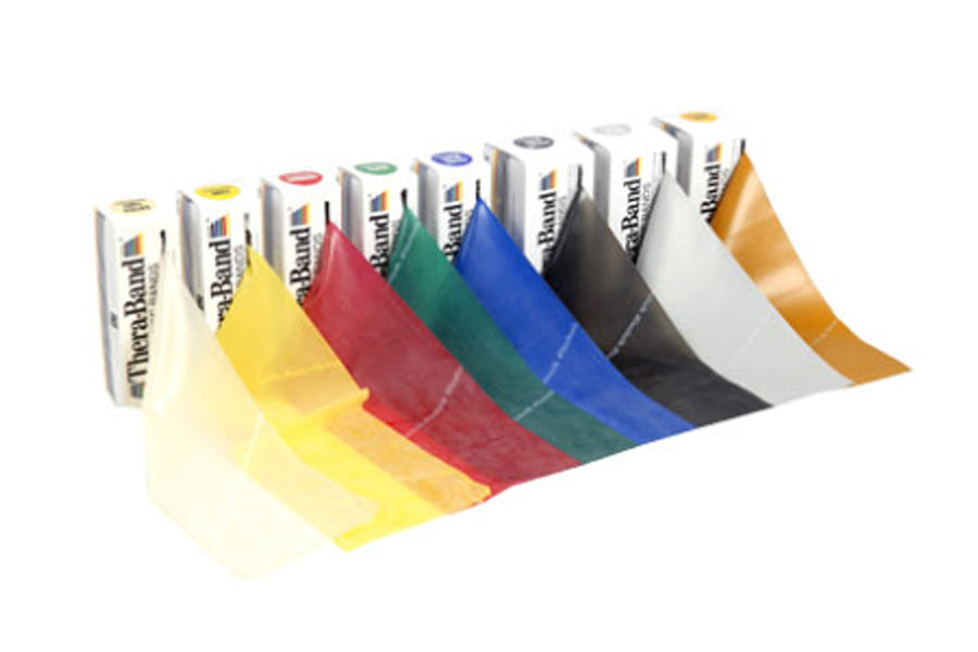 Theraband elastic resistance bands in nine colors including yellow, red, green, blue, black, white, and gold, displayed unrol