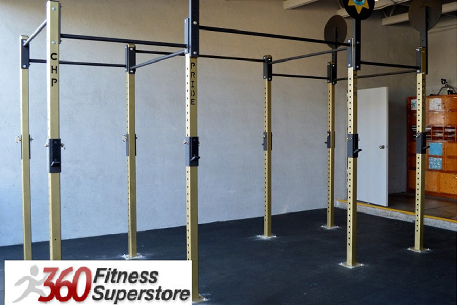 Warrior Commercial Pro Rig System with cream and black steel frame, black pull-up bars, and black rubber flooring in gym sett