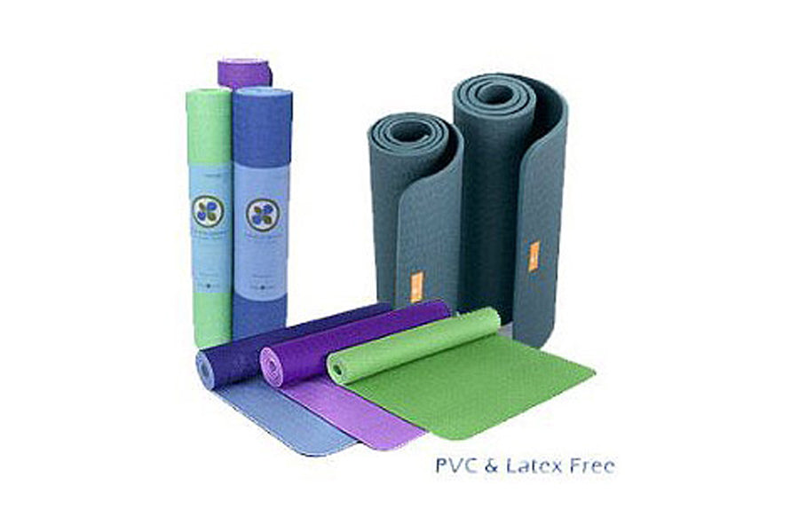 Warrior Yoga and Pilates Mats collection in multiple colors including green, blue, purple, and gray, rolled and unrolled on w