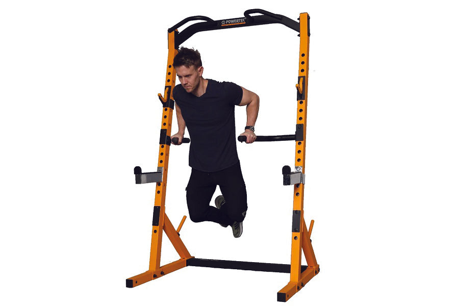 Powertec WorkBench Half Rack with yellow and black frame, man performing pull-up exercise on white background