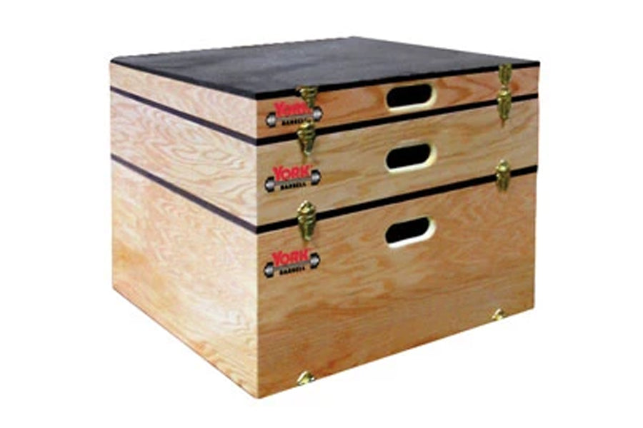 York Stackable Plyo Boxes with natural wood construction, black padded top, three pull-out drawers with brass handles, shown