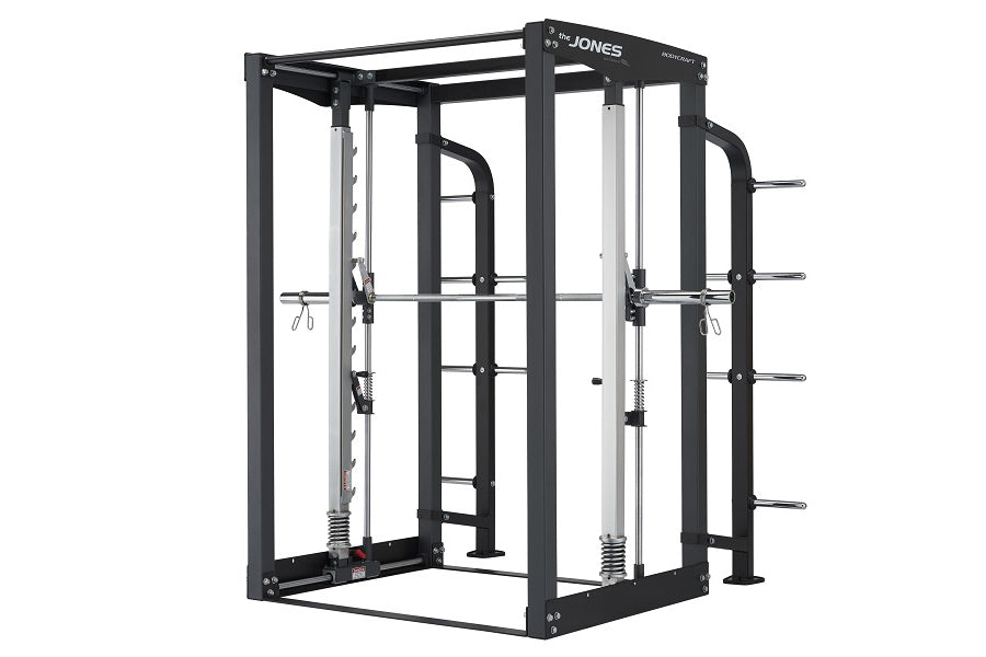 Black and silver Jones cable crossover machine with dual weight stacks and adjustable handles on white background