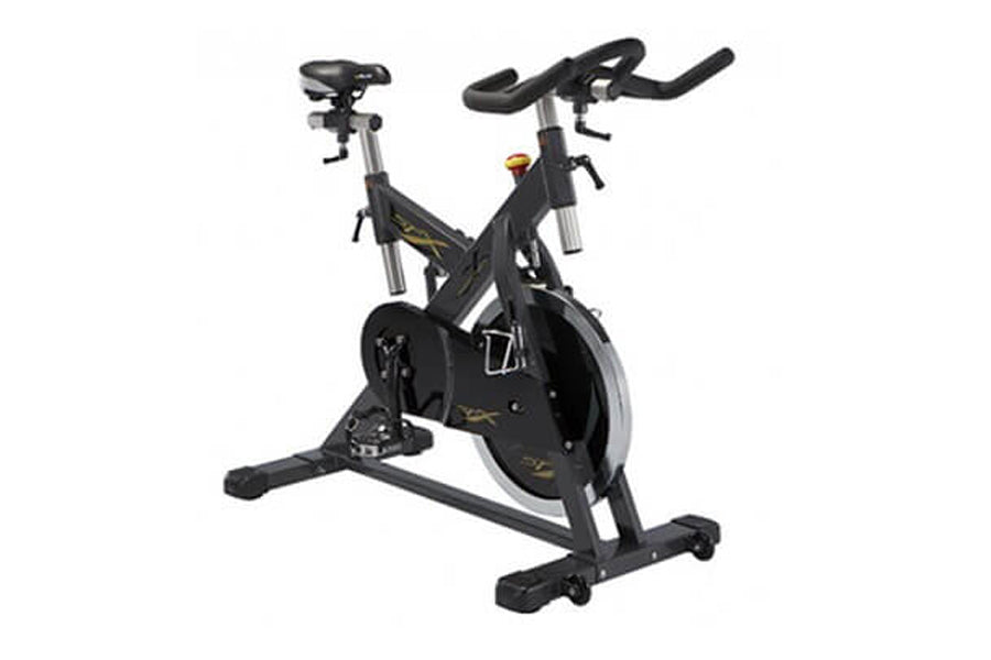 Black and gray stationary indoor training cycle with curved handlebars, padded seat, and large flywheel, on white background