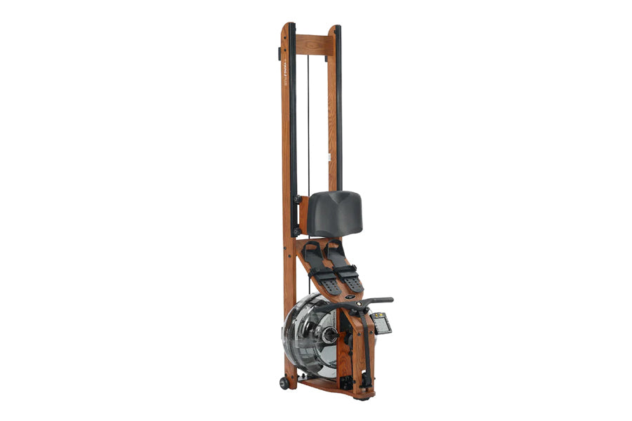 Brown wood frame fluid rower with black seat, footrest, and resistance wheel on white background