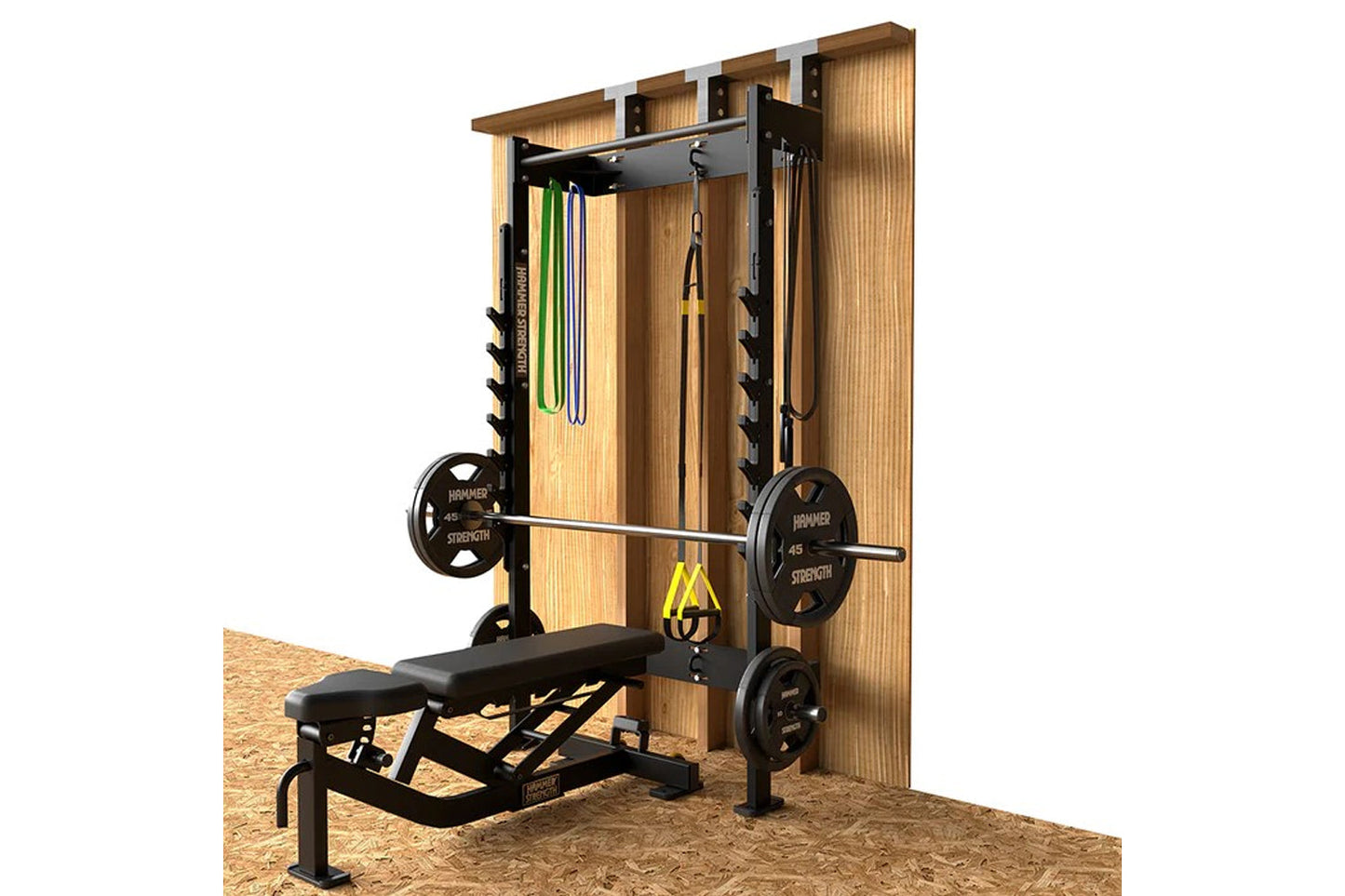 Hammer Strength home squat rack with wood frame, black metal barbell, weight plates, and suspension straps on sand