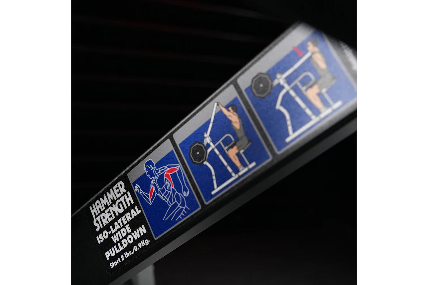 Hammer Strength Iso-Lateral Wide Pulldown machine with blue frame and instruction panels, angled view on black background