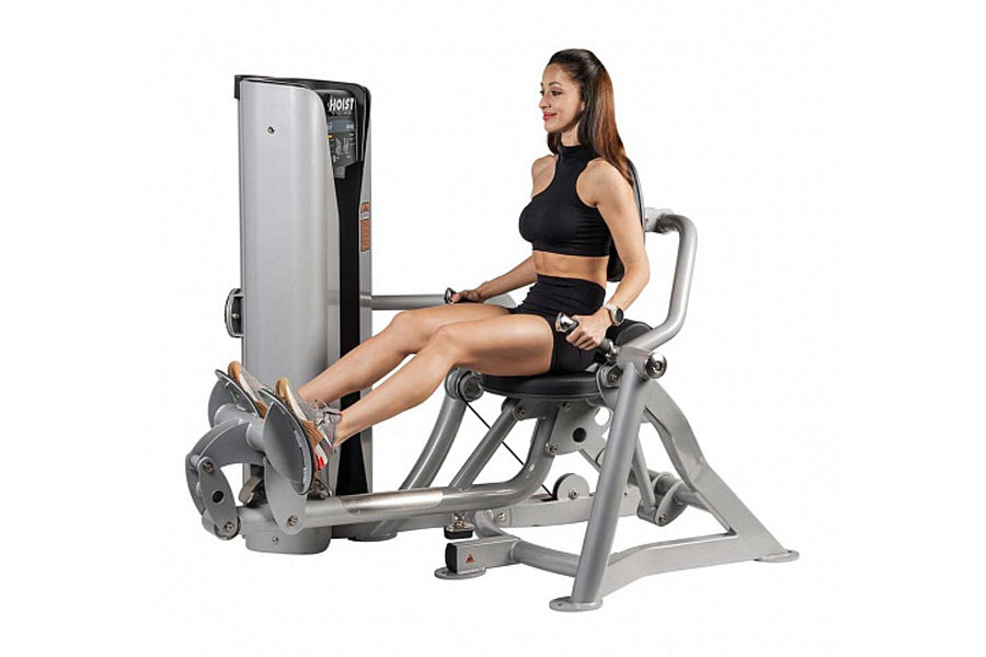 Hoist ROC-IT Lower Back Machine with silver frame and black seat, model RS-2204, demonstrated by woman in black workout attir