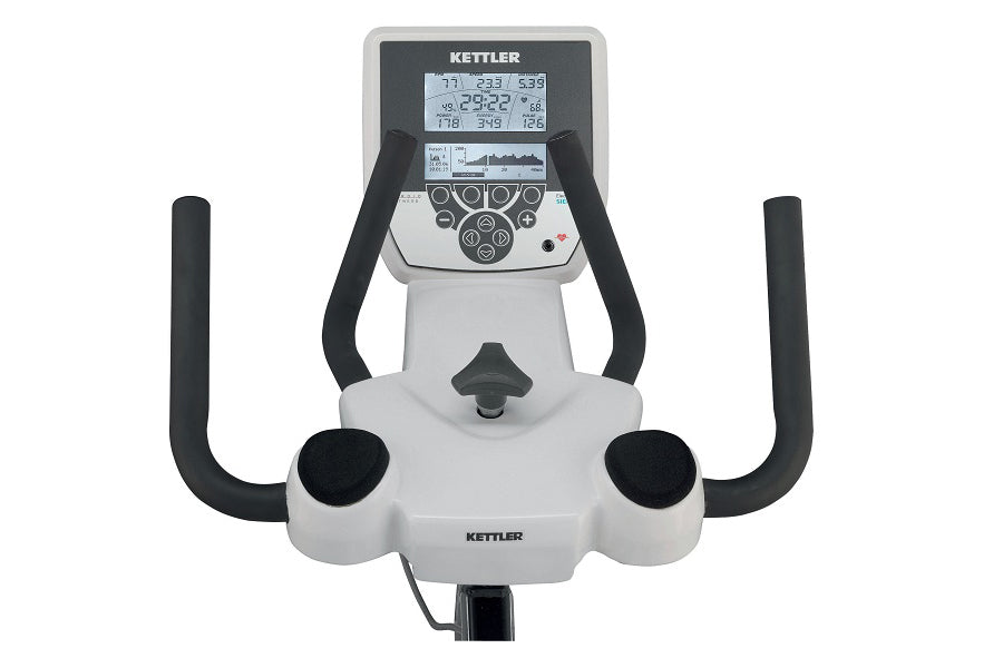 Kettler Ergo Race stationary exercise bike with white frame, black handlebars and foot pedals, digital display console showin