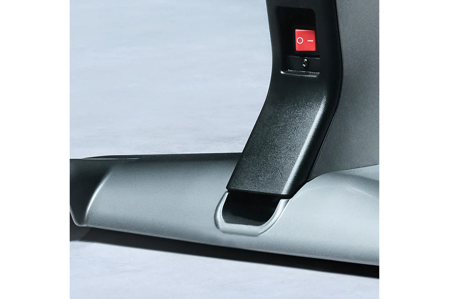 Black and silver stationary bike armrest with red power button featuring on-off symbols