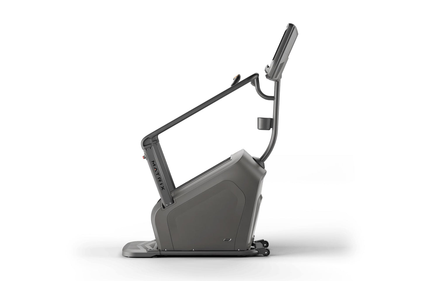 Matrix Lifestyle ClimbMill exercise bike with dark gray frame, upright handlebars, and digital display console on white backg
