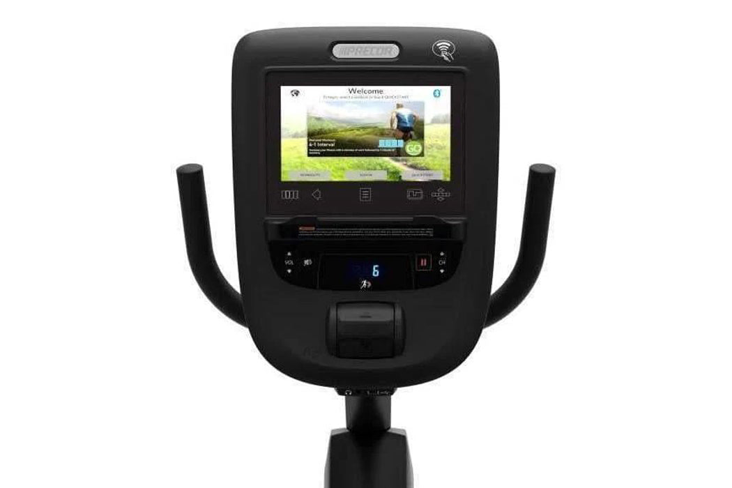 Black recumbent exercise bike with dual curved handles, digital console display showing landscape imagery, and control button