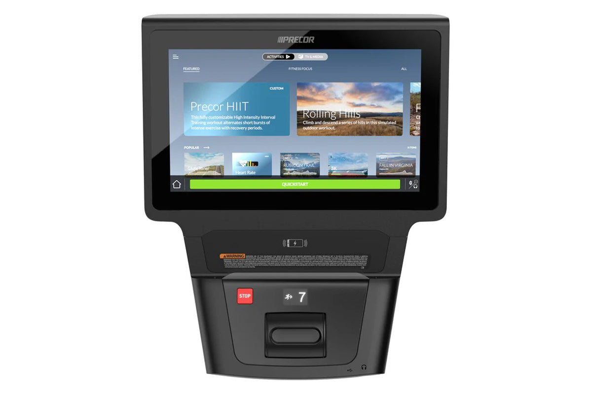 Precor RBK 685 recumbent exercise bike with black frame and integrated touchscreen console displaying fitness workout menu on