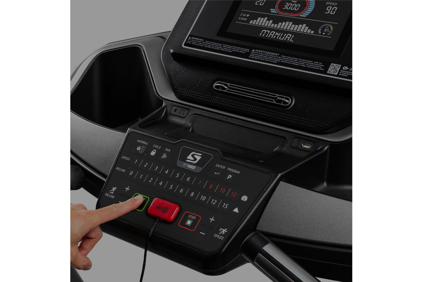 Black treadmill console with digital display, numbered speed buttons, red stop button, and hand operating control panel