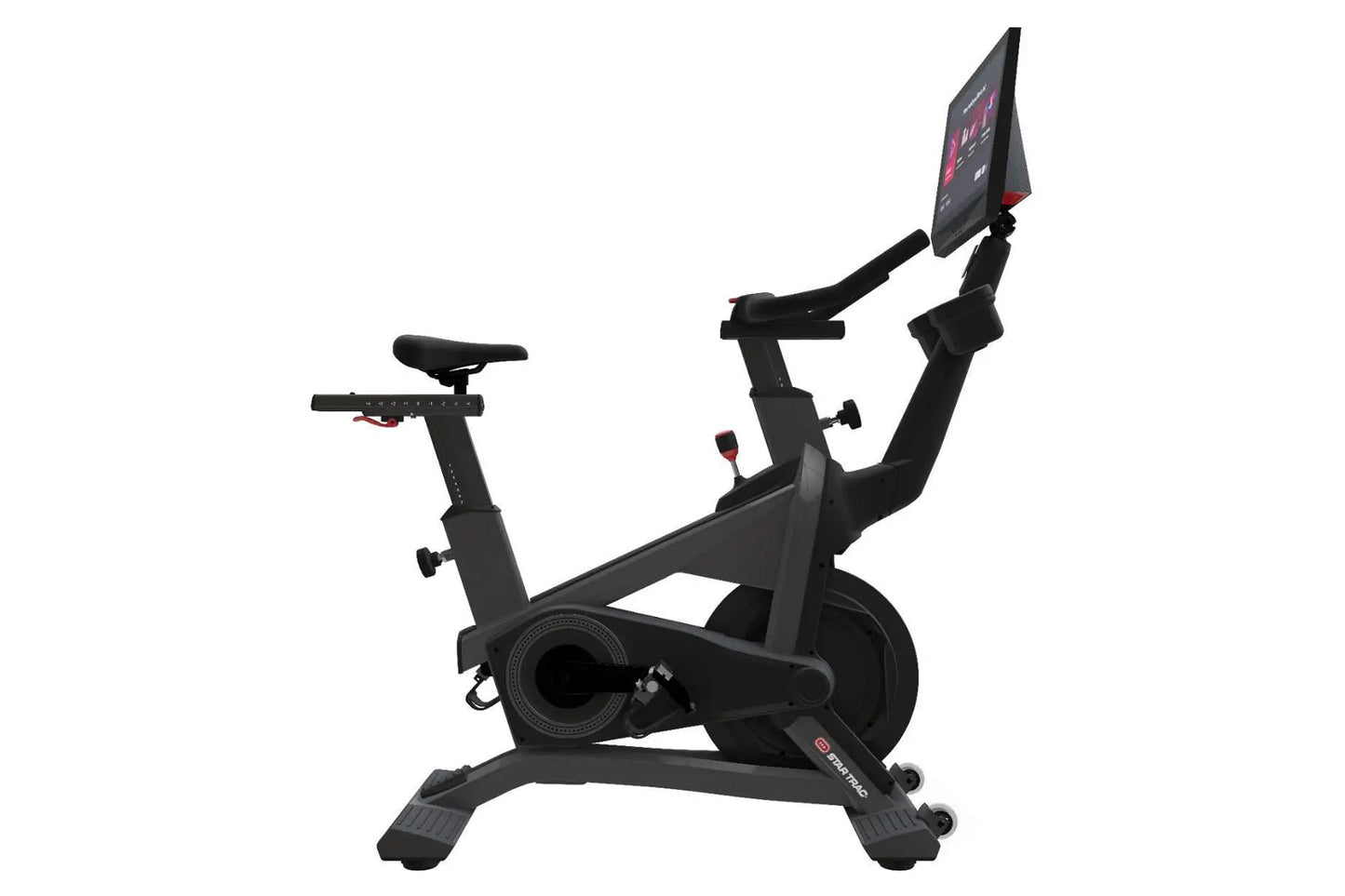 Black stationary exercise bike with tablet display showing pink interface, adjustable seat and handlebars, on white backgroun