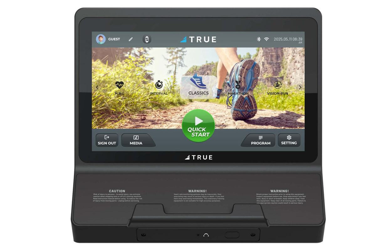 TRUE Performance 3000 treadmill with touchscreen display showing running app interface and outdoor trail scene