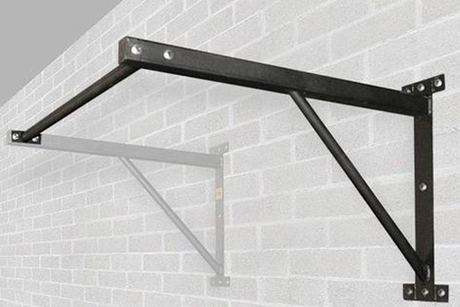 Black steel wall-mounted chin up bar with diagonal support braces and mounting brackets, installed on brick wall