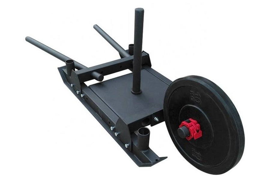 Black steel push sled with red hub wheel, dual handles, and flat platform base on white background