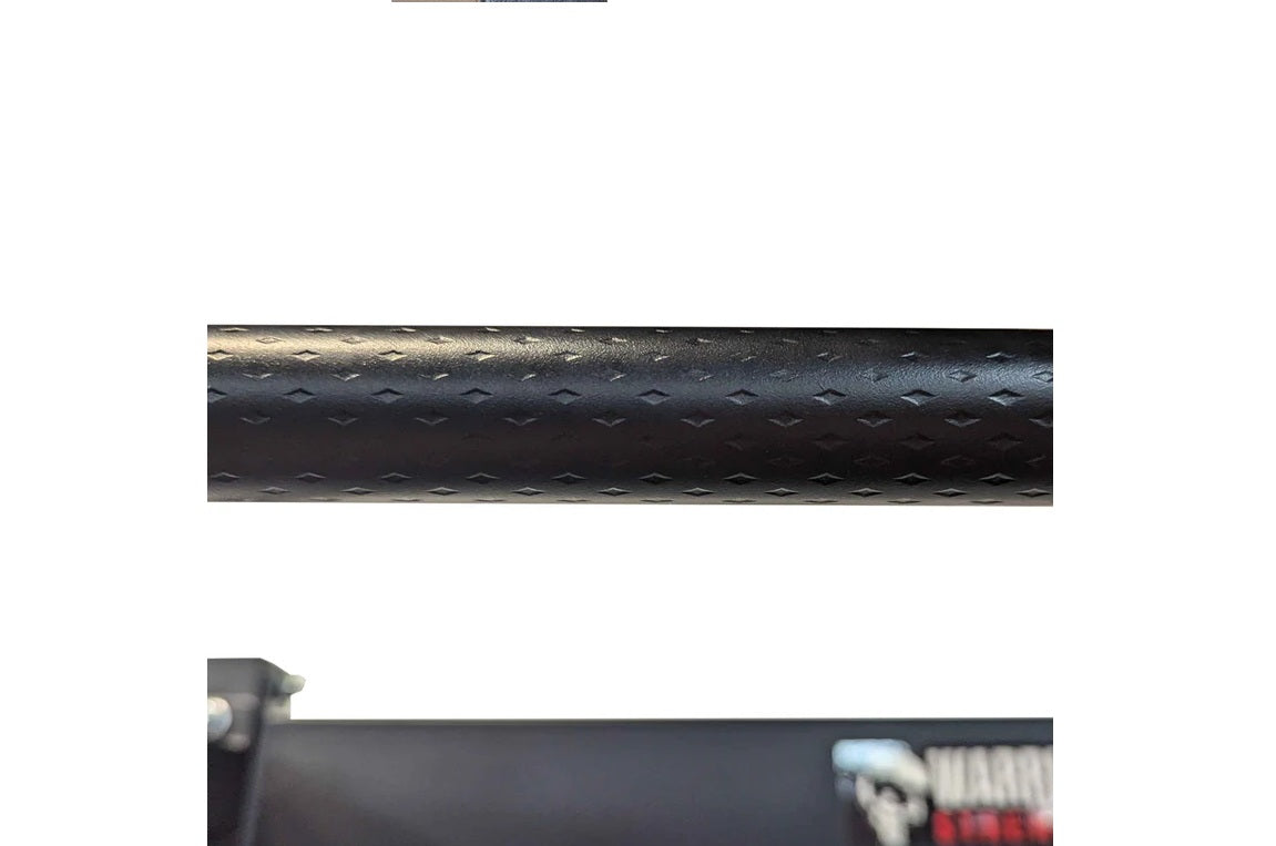 Black textured steel power rack tube with diamond plate pattern detail, close-up view