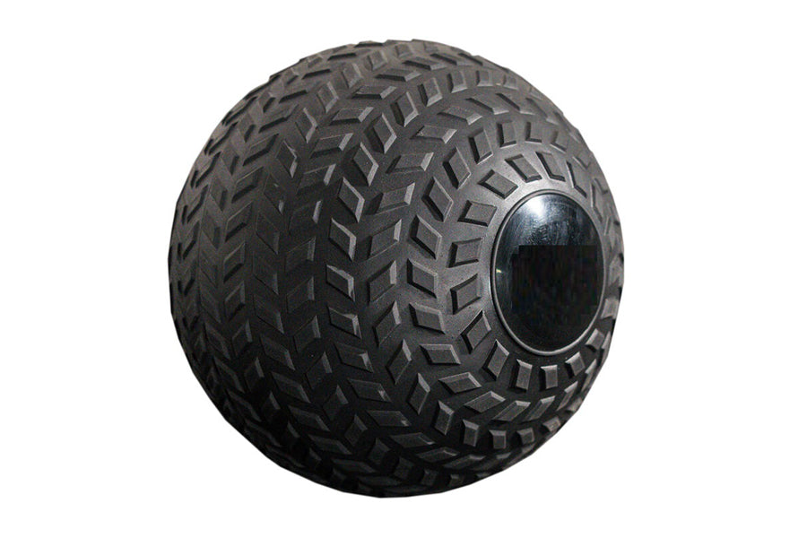 Black rubber slam ball with aggressive chevron tread pattern and metal reinforcement ring on white background