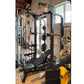 Black and gray squat rack with pull-up bars and weight storage, displayed in a gym setting with yellow weight plates visible