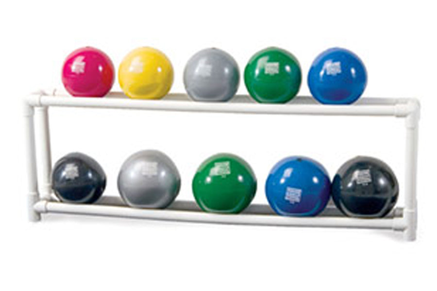 Two-tier white rack holding ten colorful medicine balls in pink, yellow, gray, green, and blue with soft touch finish