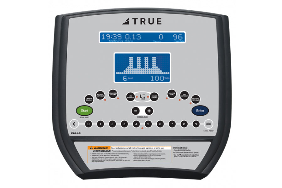 TRUE commercial recumbent exercise bike with digital display showing time, distance, and heart rate graph, control buttons in