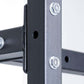 Black metal storage rack frame with adjustable horizontal bars and chrome bolts, detail view of corner joint on white backgro