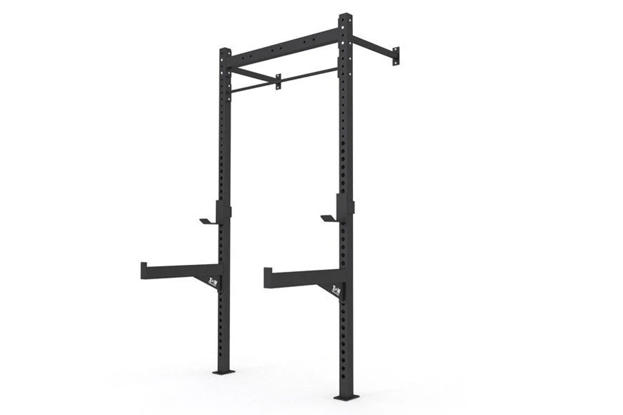 Warrior 4-2 wall-mounted squat rack with black steel frame, dual vertical posts with safety arms and pull-up bar on white bac