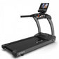 TRUE CS400 commercial treadmill with black running deck, gray frame, and touchscreen display mounted on console, on white bac