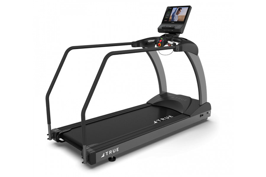 Black and gray True commercial treadmill with curved handrails, black running belt, digital display console mounted on top, o