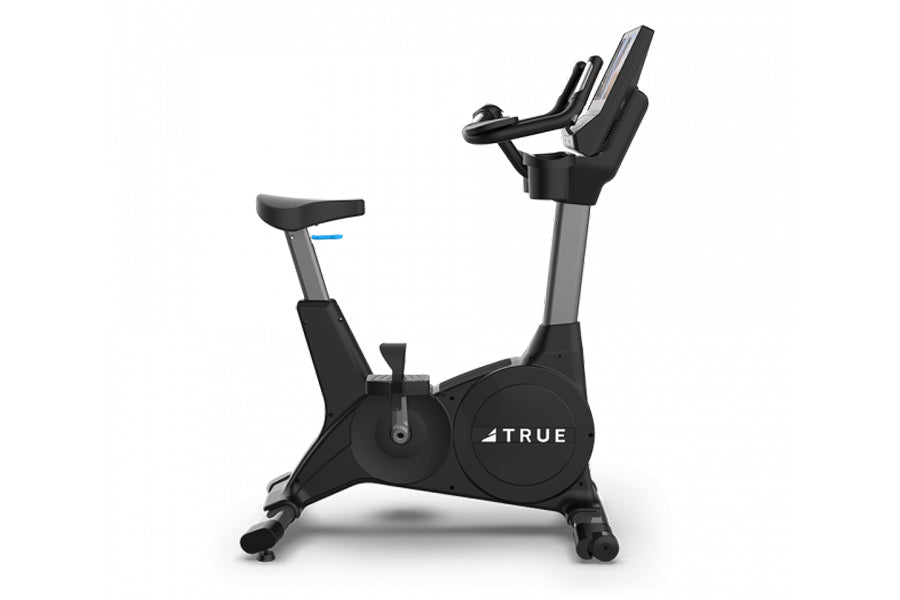 TRUE CS400 commercial upright stationary bike with black frame, gray accents, padded seat and handlebar console on white back