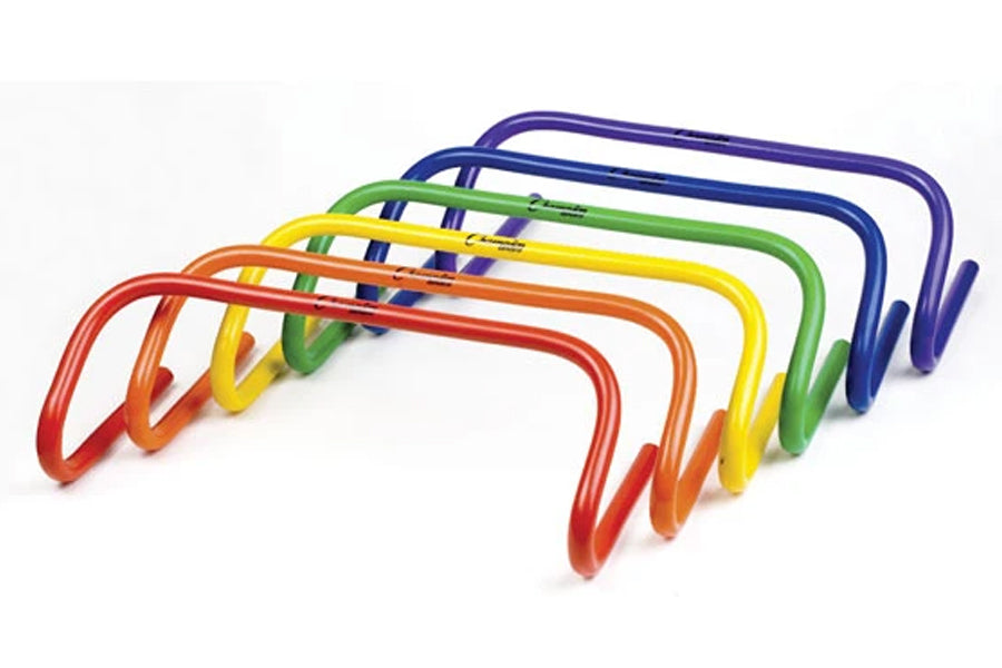 Set of six colorful speed hurdles in red, orange, yellow, green, blue, and purple, arranged in graduated sizes on white backg