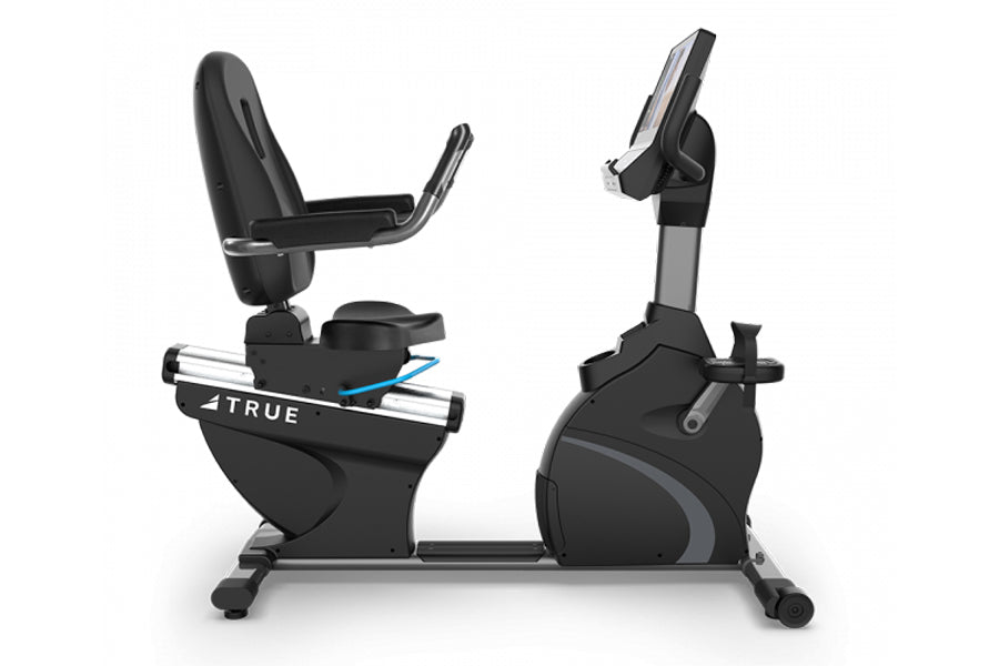 TRUE C900 recumbent exercise bike with black seat, gray accents, and digital console display on white background