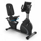 TRUE C900 recumbent exercise bike with black seat and frame, blue accent stripe, and digital display console on white backgro