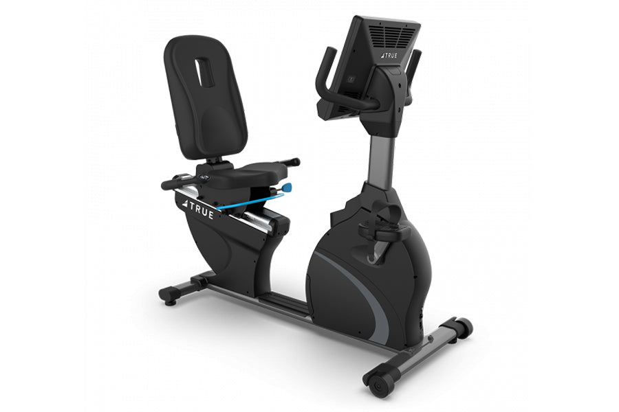 TRUE C900 recumbent exercise bike with black seat and frame, blue accent stripe, and digital display console on white backgro