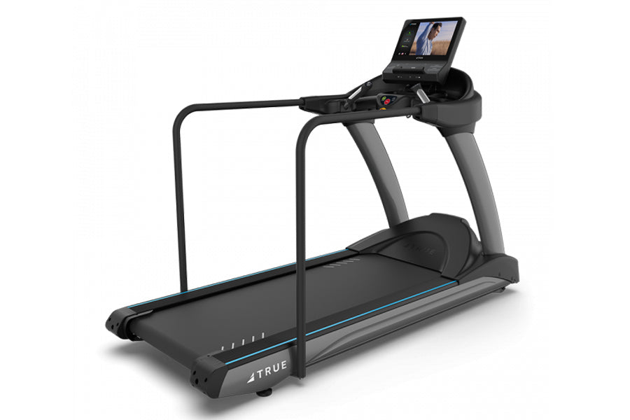 TRUE CS900 commercial treadmill with black belt, gray frame, handrails, and digital display screen on white background