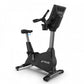 Black and gray TRUE 900 upright exercise bike with digital console display and adjustable seat on white background